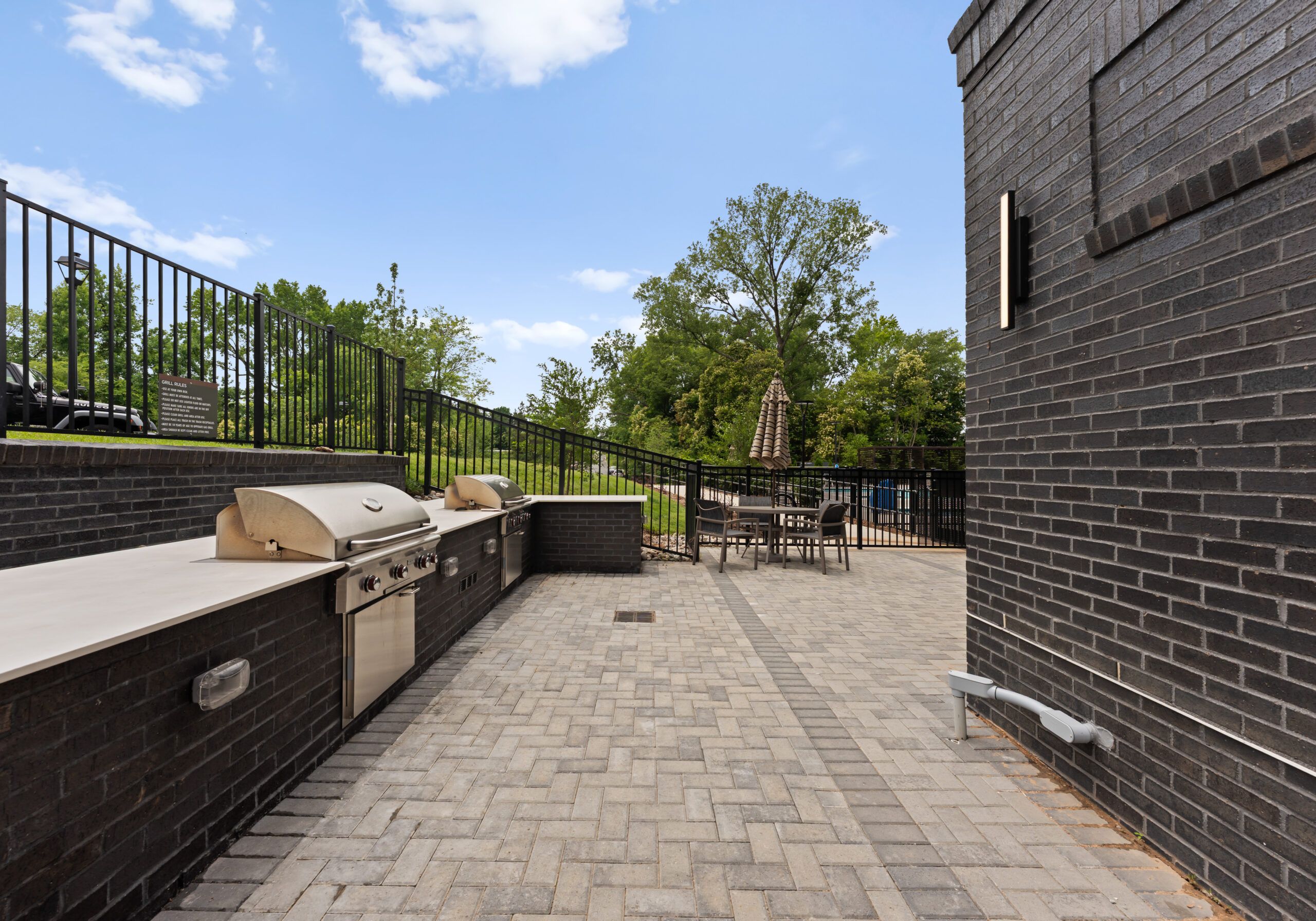 The Sloan at LoSo apartments in Charlotte, NC community amenities outdoor grilling stations