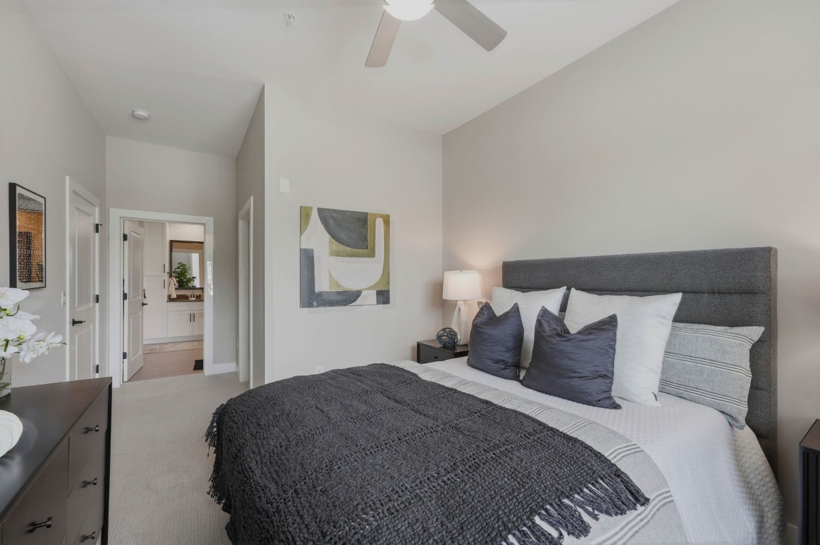 The Sloan at LoSo apartments in Charlotte, NC kithcen with white cabinets, stainless steel appliances, and lots of natural light